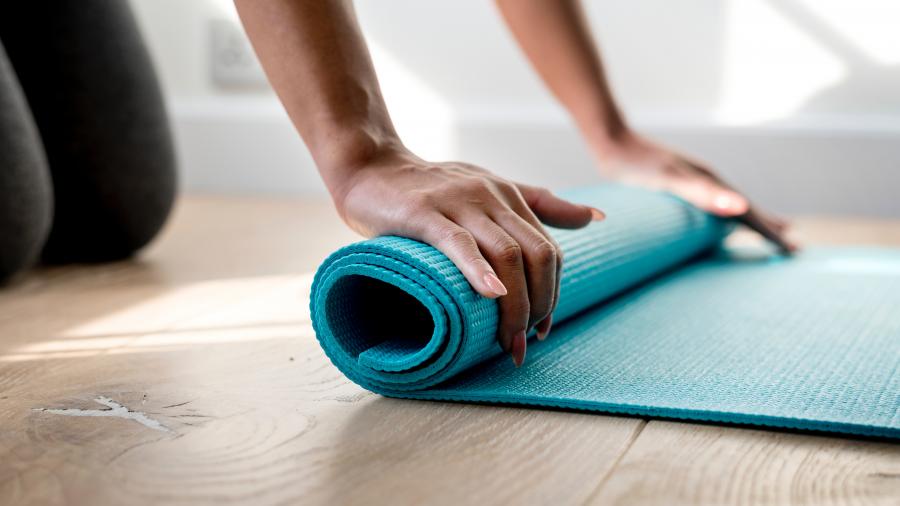 rolling up a yoga mat