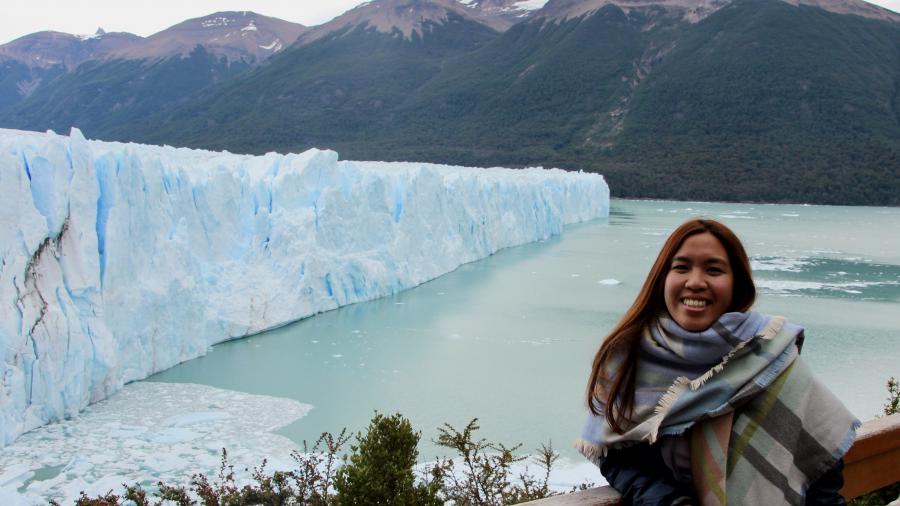 An Tran standing by a glacier