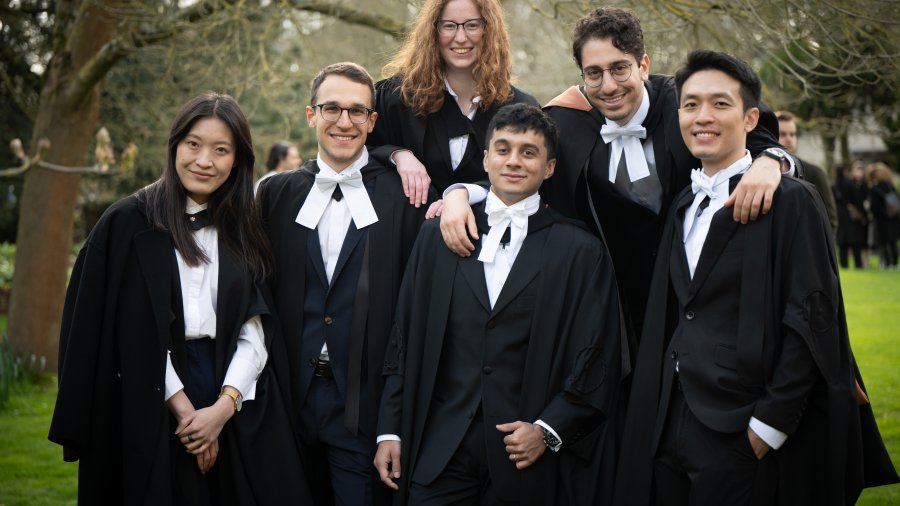 Six individuals stand together at the graduation celebrations at Wolfson College, on Saturday 23 March 2024