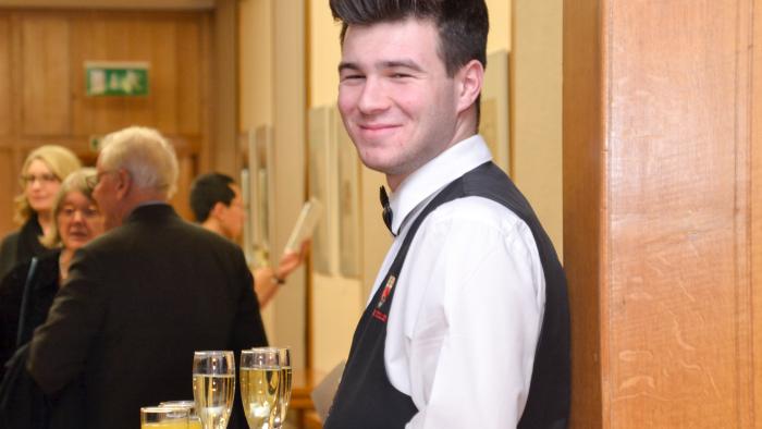 Photo of serving staff with champagne