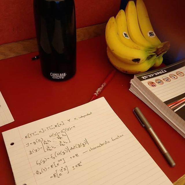 Notebooks and a banana in the library