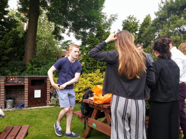 Students cooking at the barbecue in the Sundial garden
