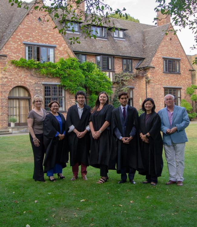 The Fellows in gowns with Professor John Naughton and Registrar Michelle Searle