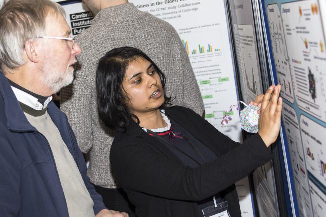 Dr Stephen Hoath looks at a poster presentation