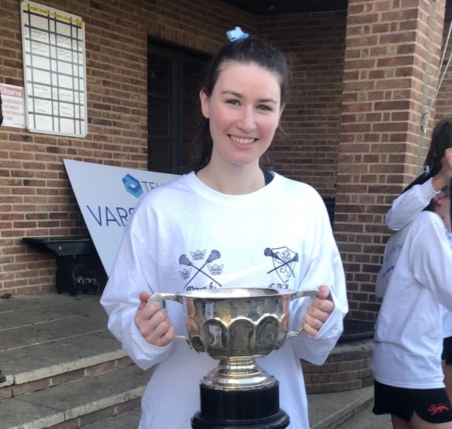 Julia Crerend with the Varsity lacrosse cup.