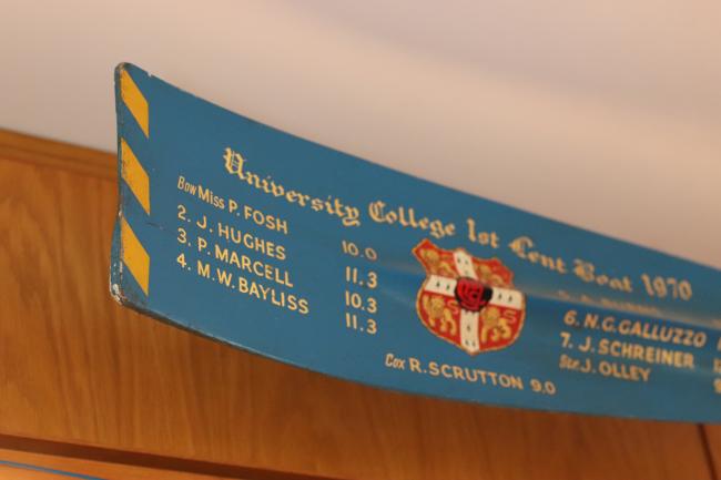 John Hughes's name on the oar above the College bar