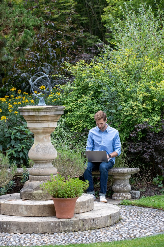 Caleb studying in the Wolfson gardens