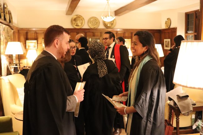 The new Fellows meet each other in the Old Combination Room
