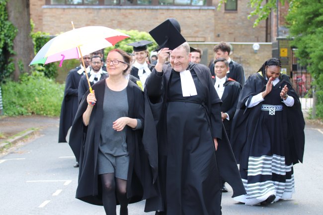 The procession begins, led by the Senior Tutor and Praelector