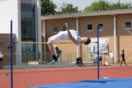 Gunther Klobe high jumping for his blue