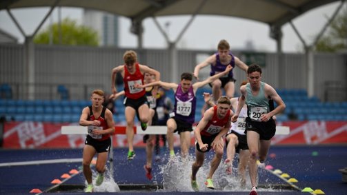 Terry Fawden leads the pack on the 300m steeplechase track
