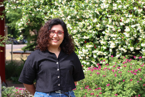 Student Fatemeh Nabizadeh standing in the Betty Wu Lee Gardens at Wolfson College